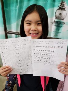 SWAN After-School students learning to read and write Chinese characters